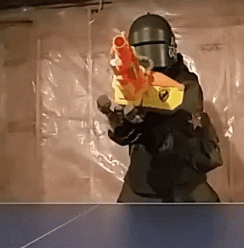 Mask Man Preparing The Machine Gun GIF