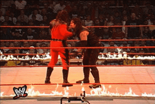 Masked Kane Chokeslam Opponent On Burning Ring GIF