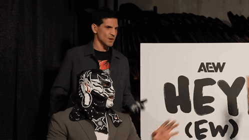 Masked Man Next to Hey (Ew) Sign