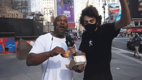 Masked Man With Food Box at HBO Max Sign