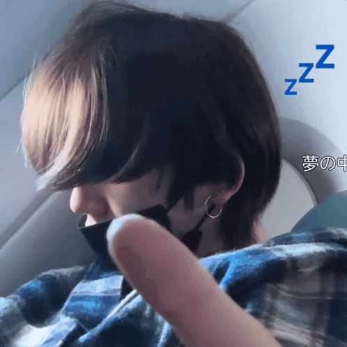 Masked Person Sleeping on Airplane With Zzz