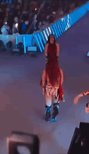 Masked Woman Dancing with Smackdown Sign