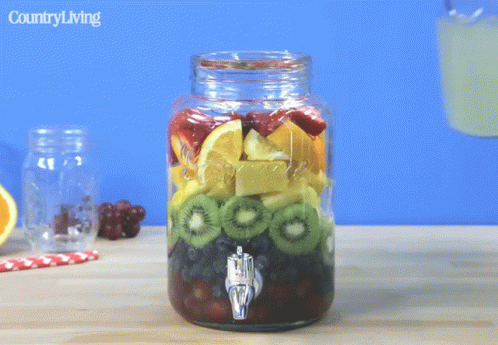 Mason Jar Fruit Pouring Into Glass Country Living