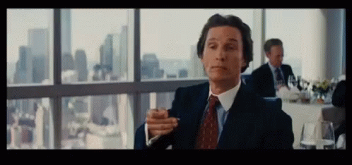 Matthew Mcconaughey Stretching Arm Wolf Of Wall Street GIF