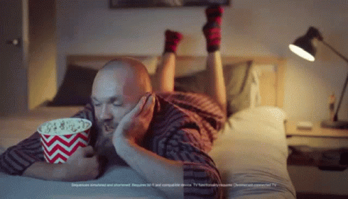 Max Gawn Watching In Bed Eating Popcorn GIF