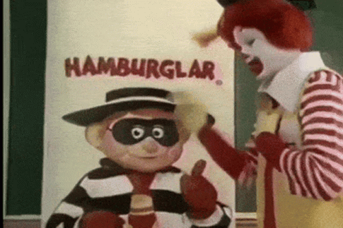 Mcdonald 'S Mascots Are Standing In Front Of A Sign That Says " Hamburglar " GIF