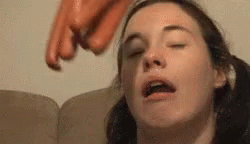 Sleeping Woman Slap By Meat Sausages GIF