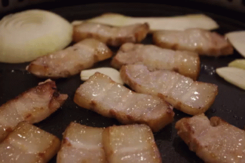 Meat Cooking In Pan With Onions And Garlic GIF