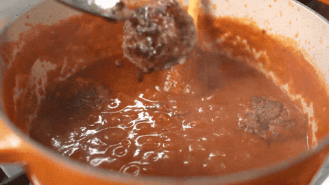 Meatball Being Thrown Into Saucepan GIF