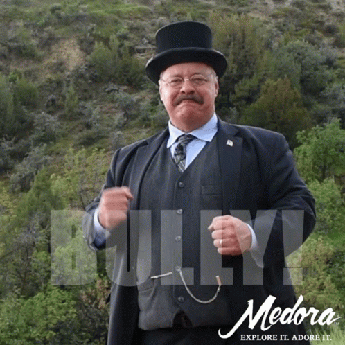 Medora Explore It Ad with Man in Suit and Top Hat