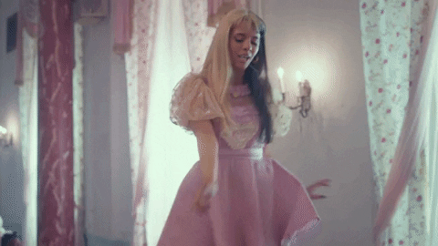 Melanie Martinez Wiping Table With Feet GIF