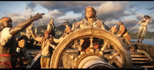 Men Around Large Boat Steering Wheel