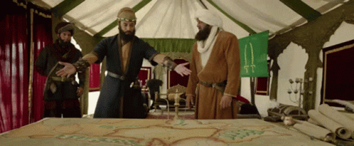 Men Around Table With Map and Flag tt