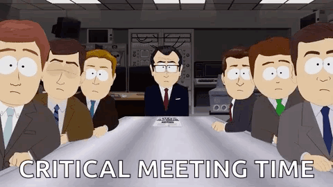 Men at Table Critical Meeting Time