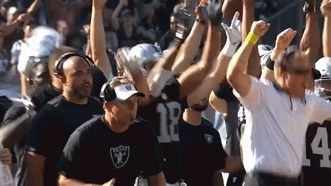 Men Cheering on Football Field