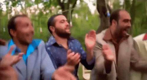 Men Clapping in a Park