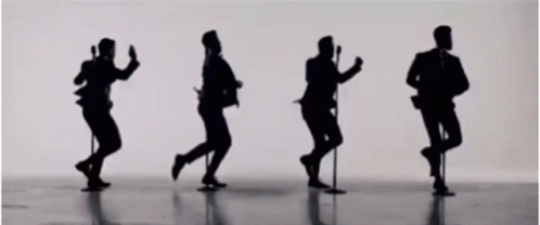Men Dancing and Singing Into Microphones