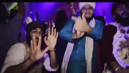 Men Dancing In Dark Room With Purple Lights GIF