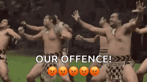 Men Dancing in Field With Our Offence