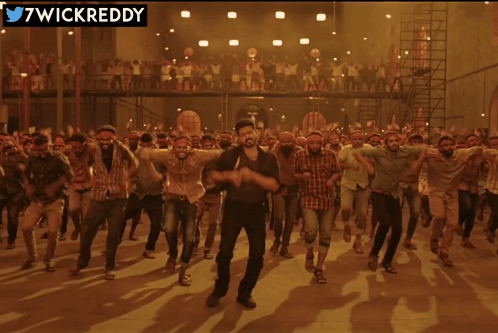 Men Dancing in Front of 7wickreddy Sign