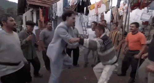 Men Dancing in Street