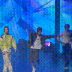 Men Dancing on Blue Stage