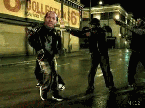 Men Dancing On Street At Collection Store GIF