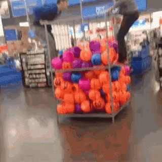 Men Fell Down On Balloons Walmart Funny GIF