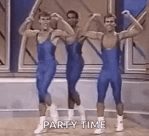 Men Flexing Muscles In Gym GIF