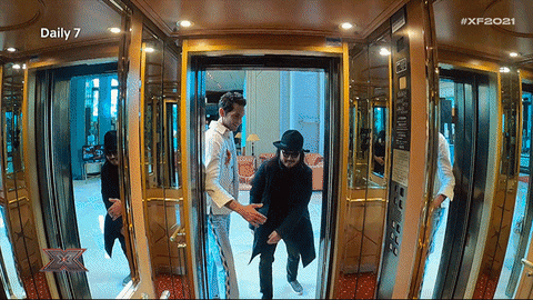 Men Getting Inside Elevator All Together GIF