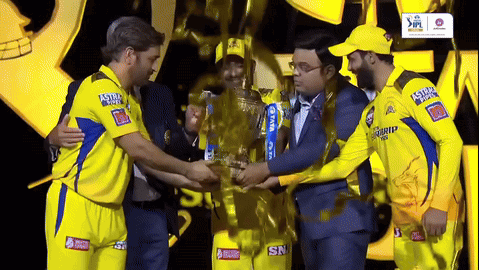 Men Holding IPL Trophy