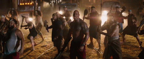 Men Holding Weapons in Line