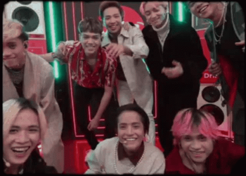 Men Hugging In Front Of March Poster GIF