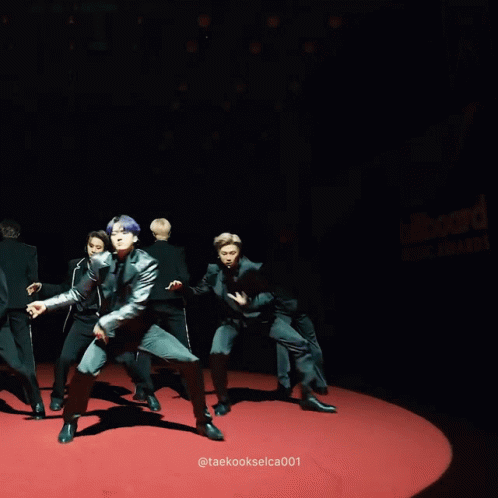 Men In Black Suits Performing On Red Carpet GIF