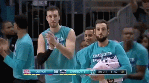 Men In Blue Shirts Applauding In Stadium GIF
