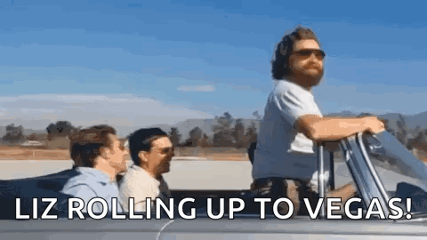 Men in Convertible Car Liz Rolling Up to Vegas