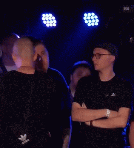 Men in Dark Room One Wearing Black Adidas Shirt