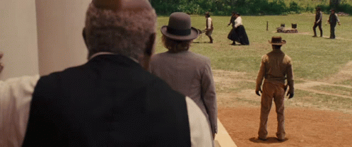 Men in Field, One With Bowler Hat