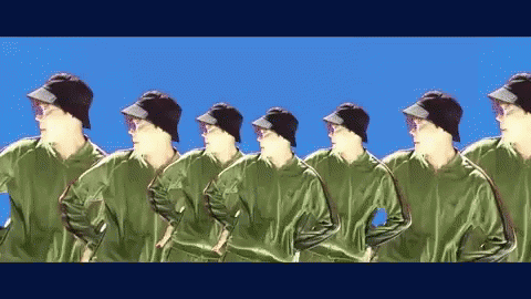 Men in Green Jackets and Black Hats in Row