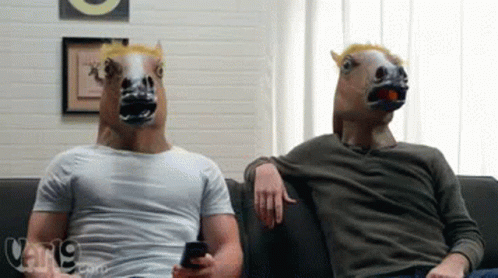 Men in Horse Masks Sitting