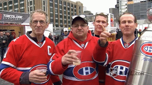 Men in Jerseys With H Holding Beer Cups