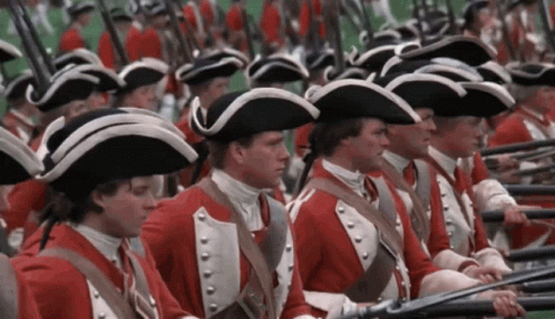 Men In Red Uniforms And Hats Holding Guns GIF