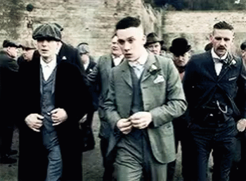 Men In Suits And Hats Standing Together GIF