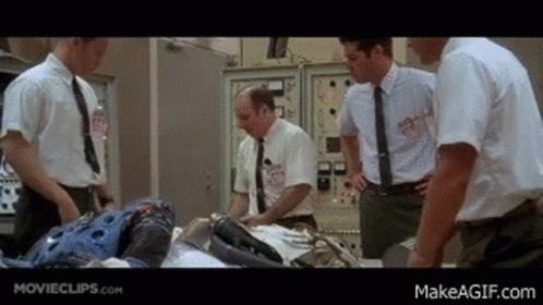 Men In Suits Around Table With Robot GIF
