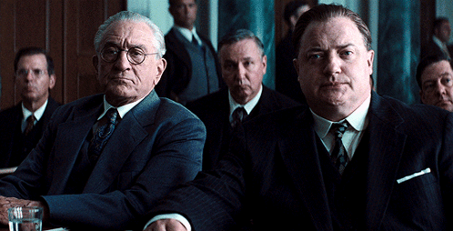 Men In Suits Sitting Around Table GIF