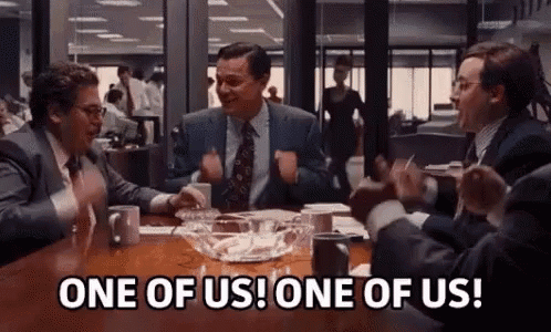 Men In Suits Sitting At Table With Ashes GIF