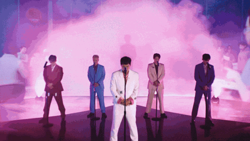Men in Suits Speaking at Microphones