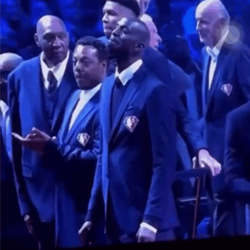 Men In Suits Standing In Front Of Crowd GIF