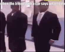 Men in Suits Standing in Hallway