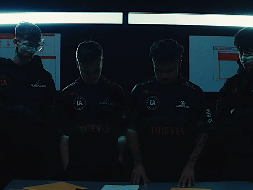 Men in Thief Shirts Standing